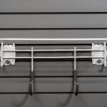 shelf with 2 hooks attached to slatwall