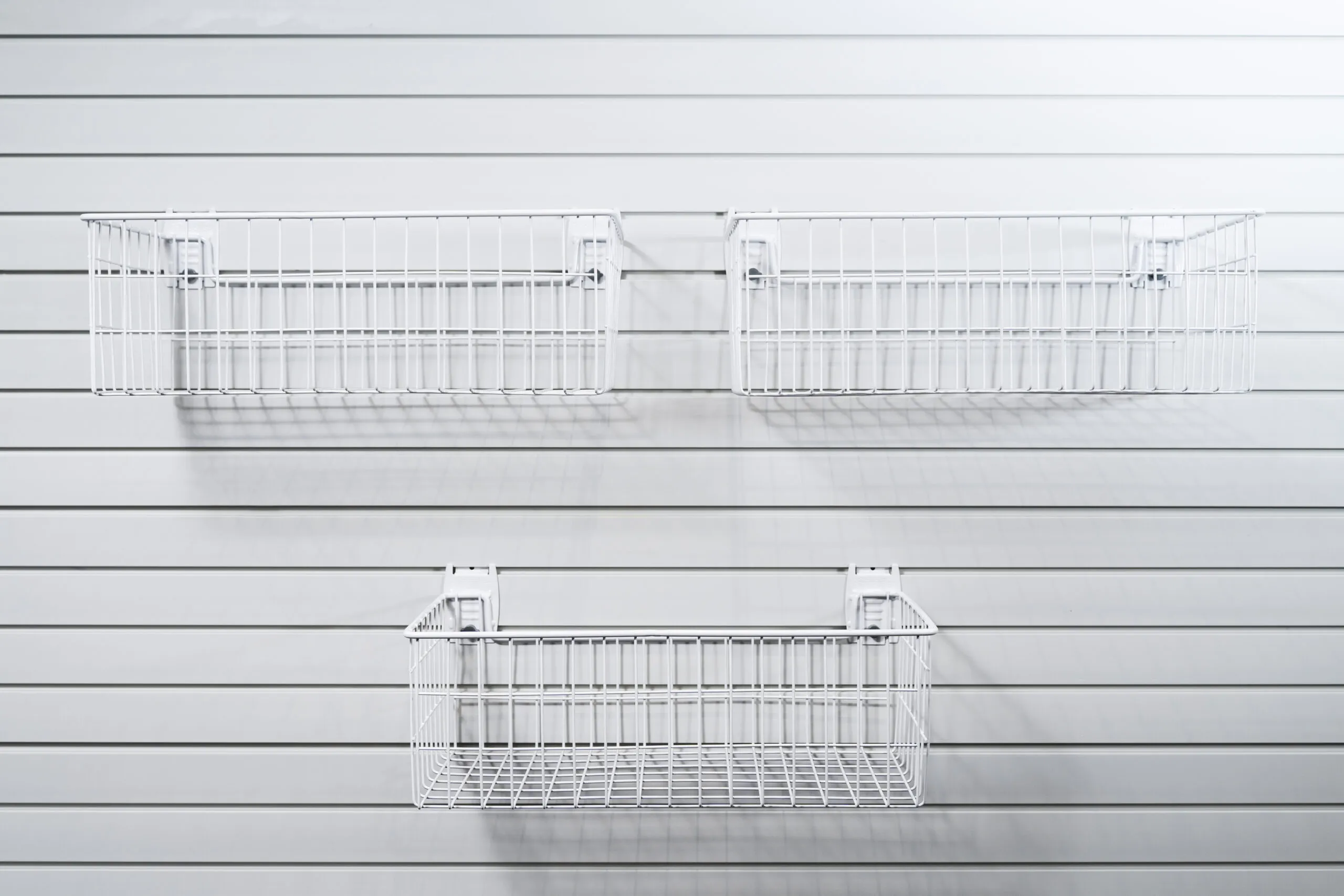 set of 3 deep storage baskets on slatwall