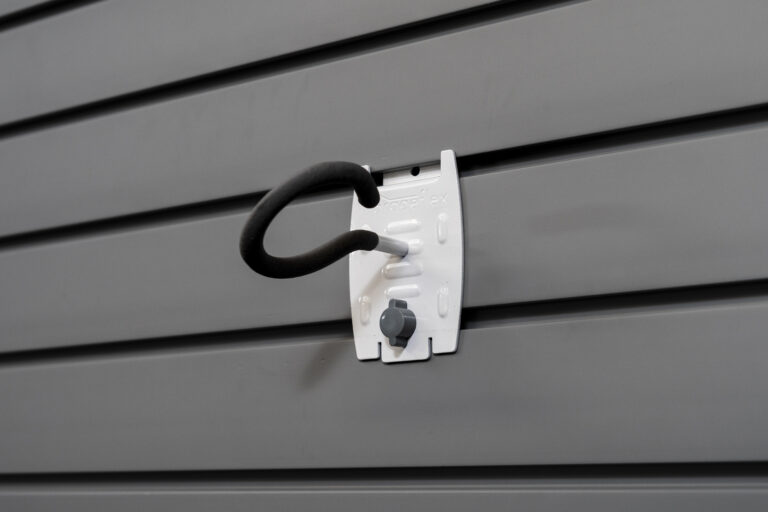 fishing pole holder on slatwall