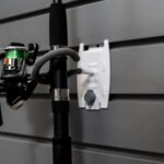 fishing rod held in hook attachment to flexipanel slatwall