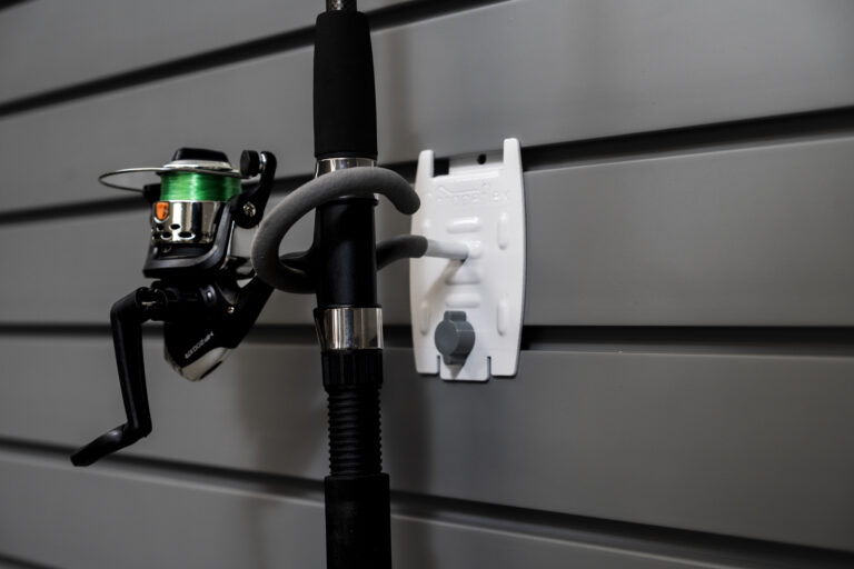 fishing rod held in hook attachment to flexipanel slatwall