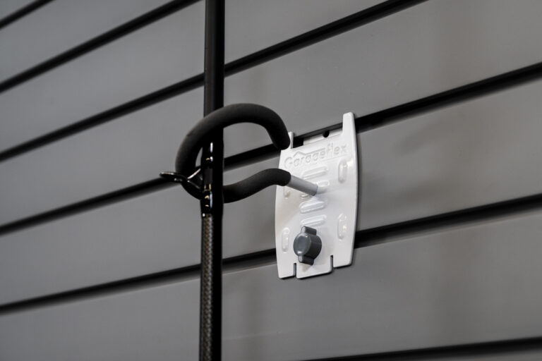 fishing rod hook attached to flexipanel slatwall holding fishing rod