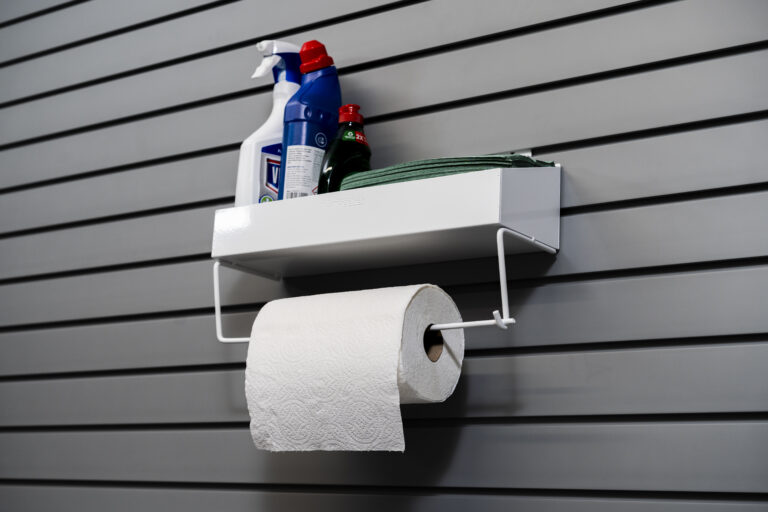 paper towel rack holding cleaning products