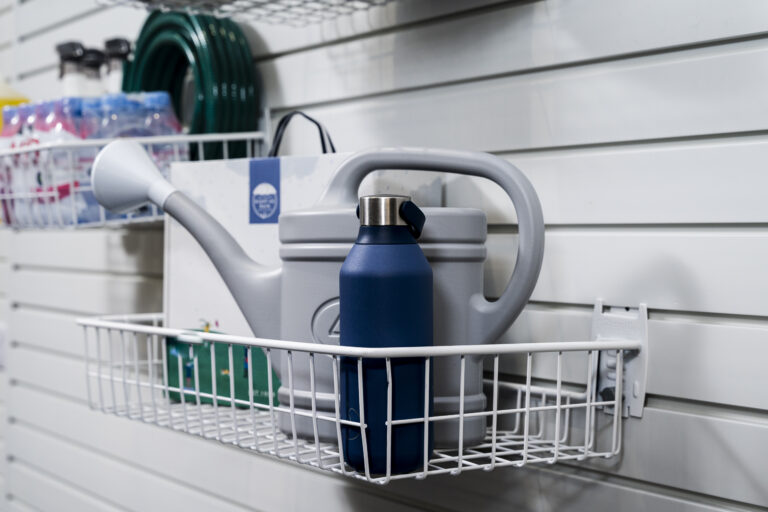 shallow basket holding a watering can