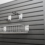 grey flexipanel slatwall panel with hooks and basket attached